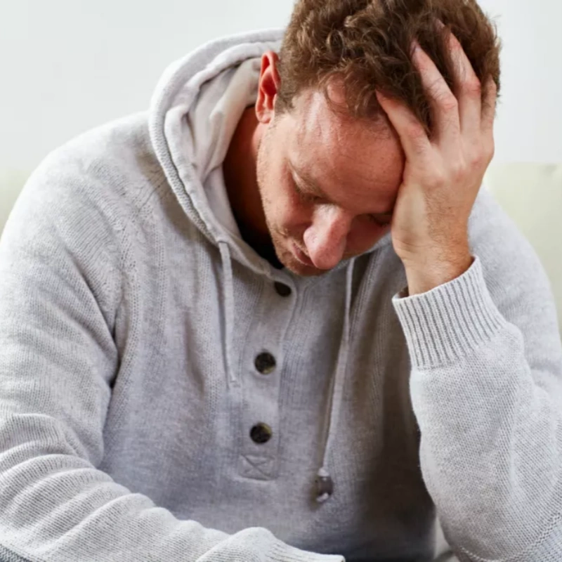 low self confidence man with head in hand 960px